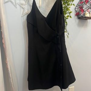 Black dress w/ thin straps. Cute to layer with